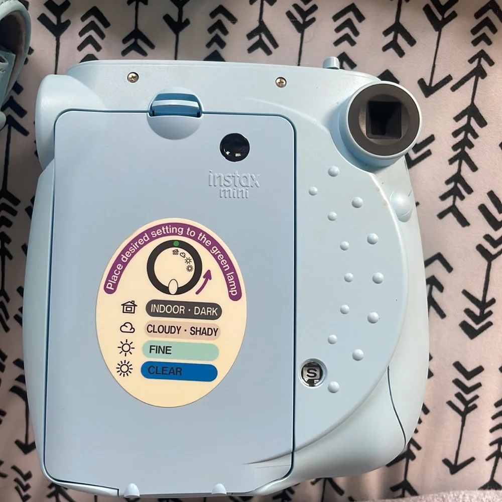Light blue fujifilm instax mini 75 camera. With case and 2 film cartridges.
